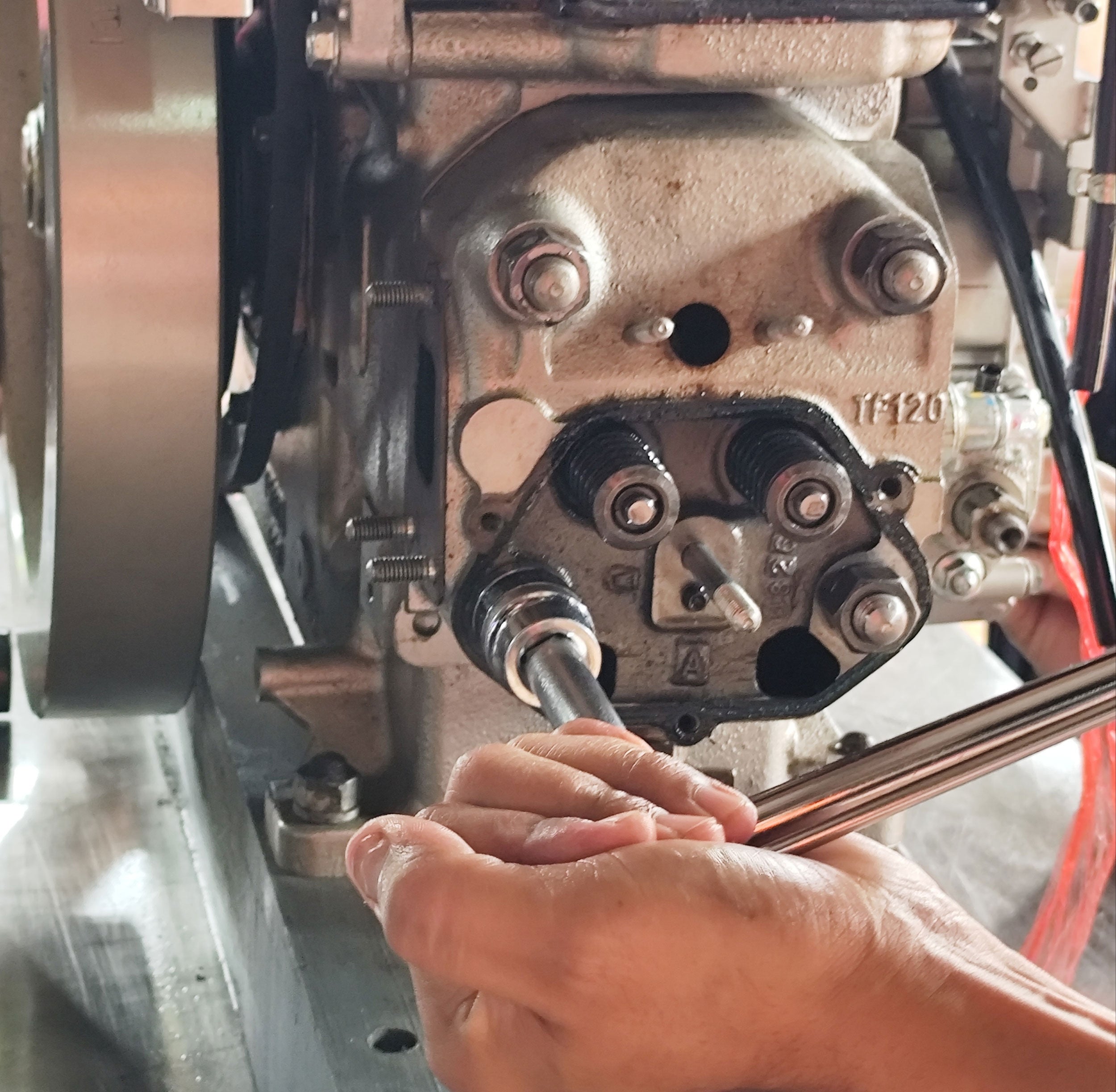 student-repairing-farm-machinery